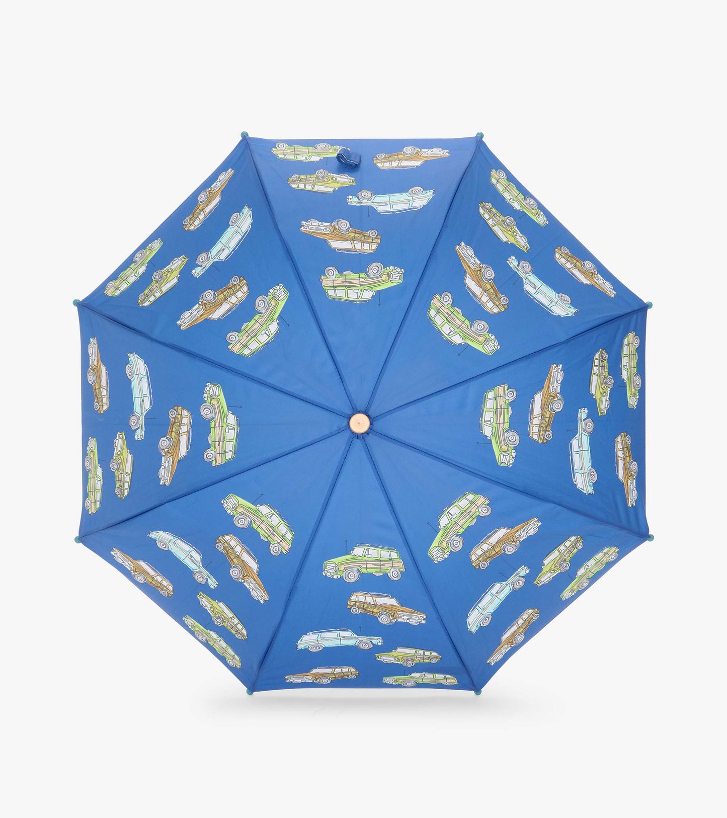 Top view of open blue umbrella with vintage truck print across the canopy