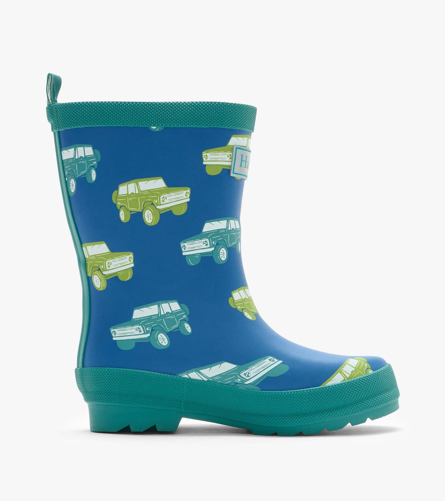 Single blue rain boot with green trim and vintage truck print, side view