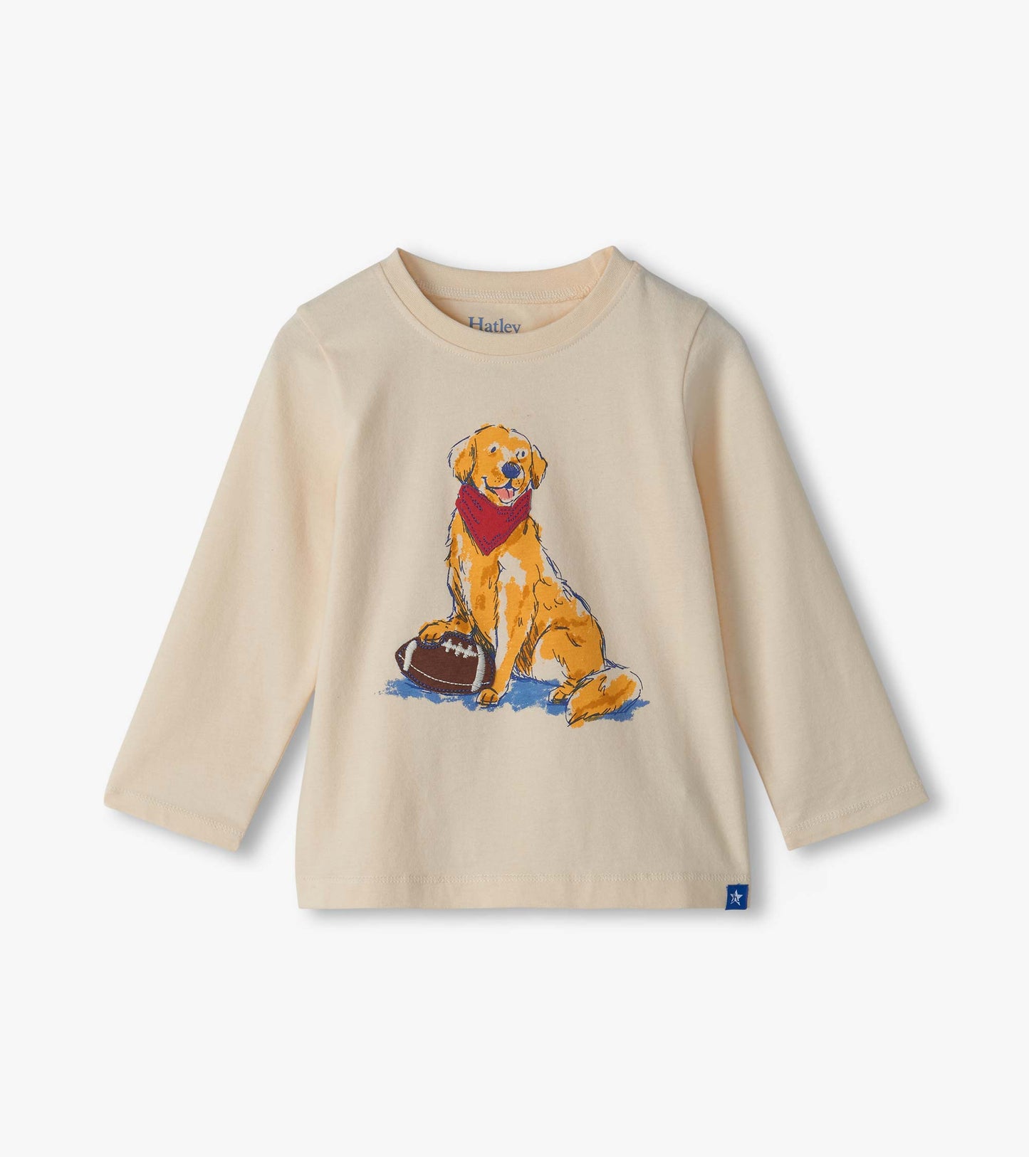 Cream long sleeve crew neck tee with golden lab graphic wearing a red bandana beside a football