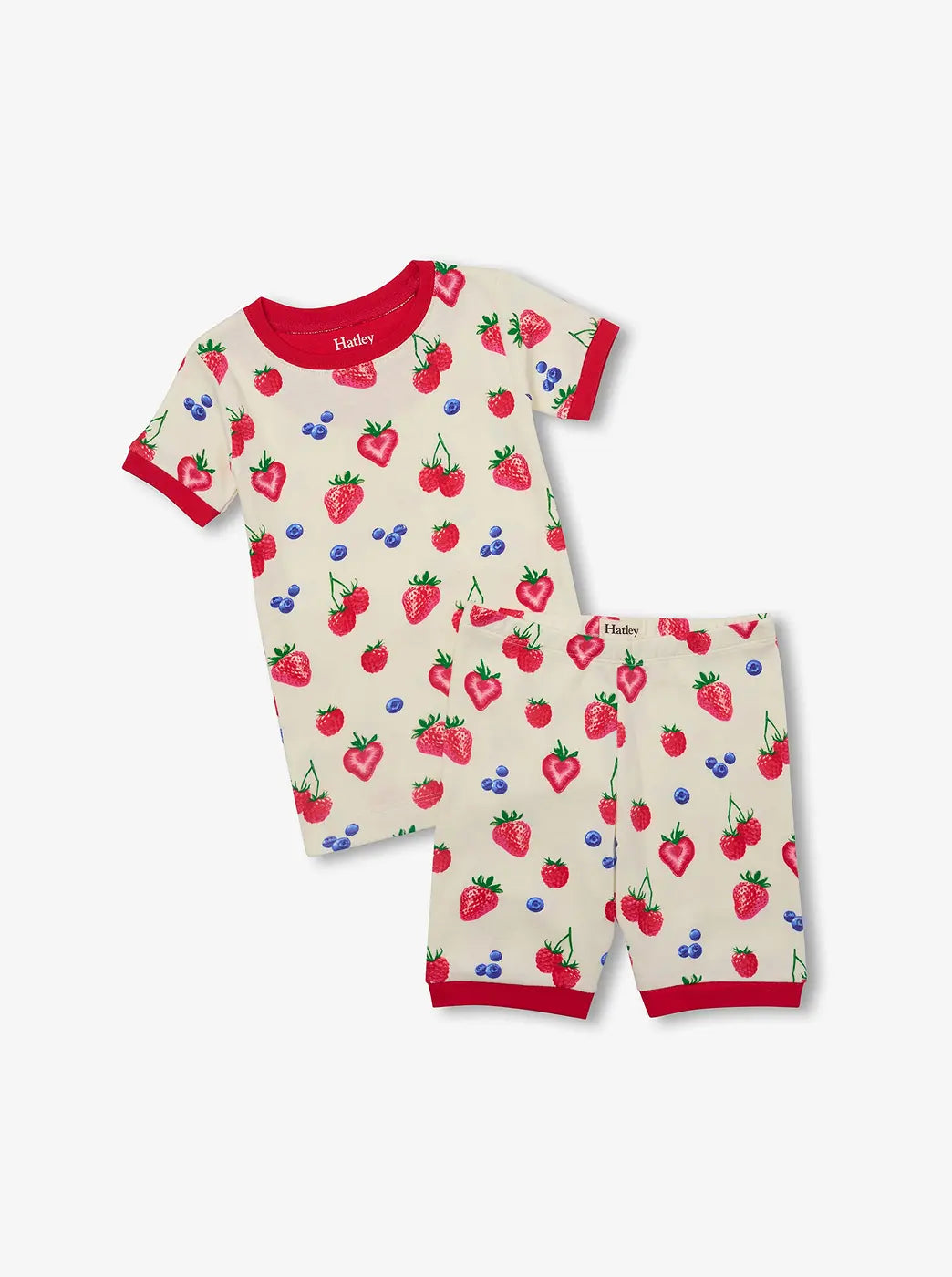 Shop kids' sleepwear. Showing cream short-sleeve pyjama set with strawberry, raspberry and blueberry print.