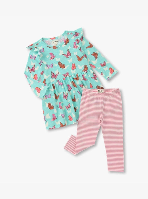 Promotes baby sale collection. Showing turquoise butterfly-print baby dress with pink striped leggings.