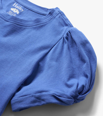 Blue girls' long-sleeve T-shirt with twisted sleeve detail, folded close-up view