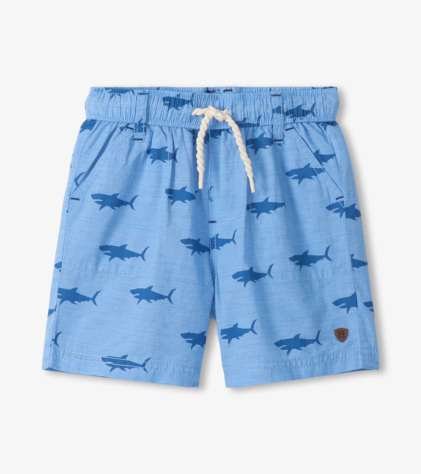 Light blue boys shorts with dark shark print, elastic waistband, white drawstring, front view