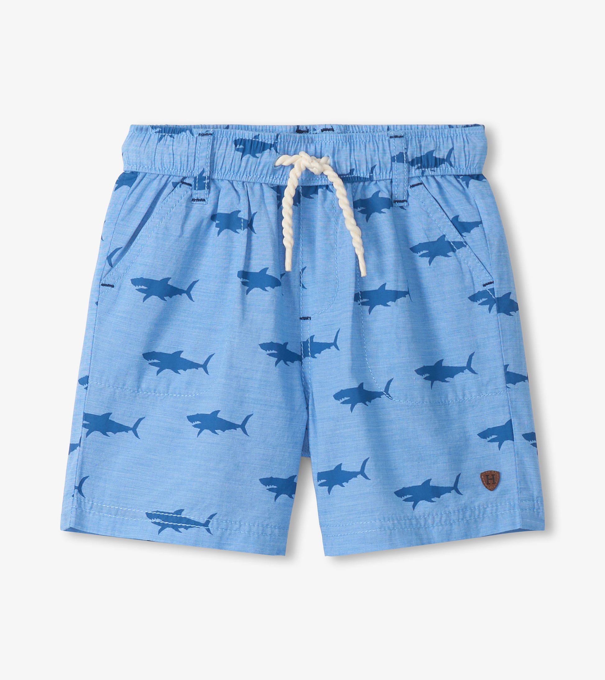Light blue boys shorts with dark shark print, elastic waistband, white drawstring, front view