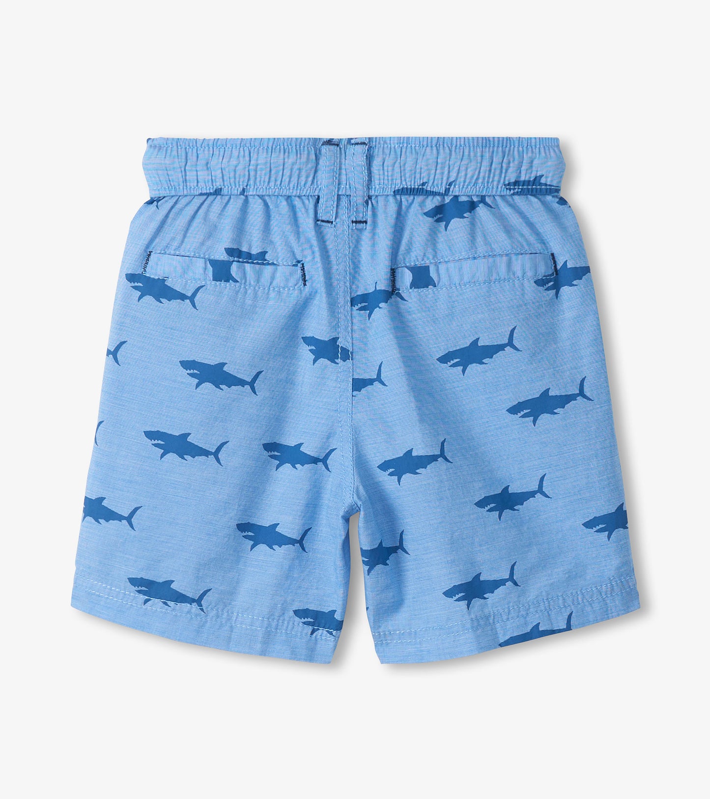 Light blue boys shorts with dark shark print, elastic waistband, and back pockets, front view
