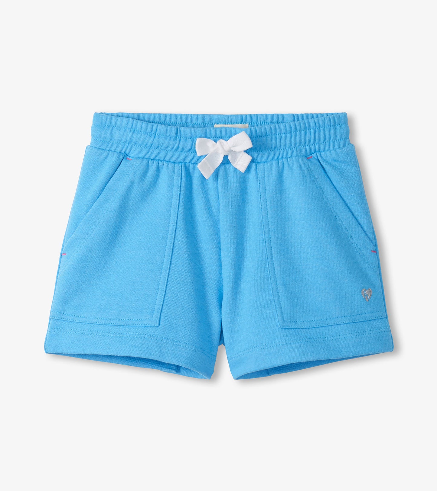 Light blue girls shorts with elastic waist, white bow, front pockets, and small heart logo.