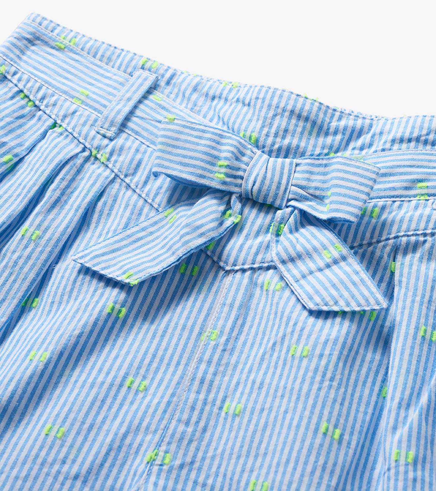 Blue and white striped girls' paper bag shorts with neon green dots and a tied waist detail, close-up front view