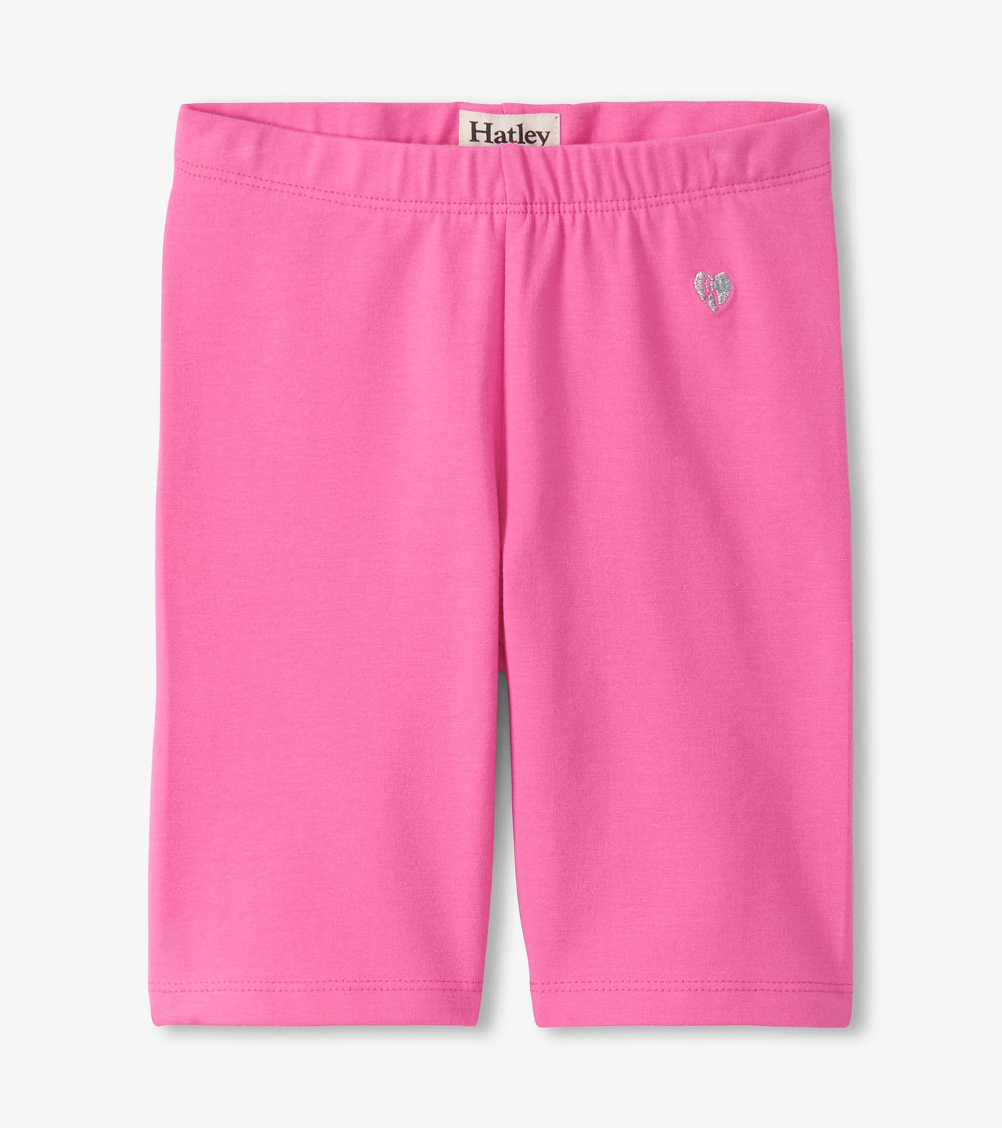 Pink girls bike shorts with elastic waistband and small heart graphic, front view