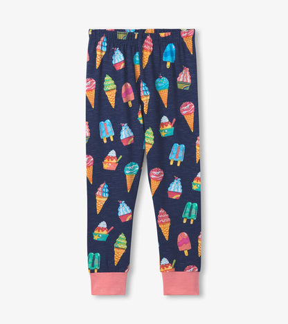 Navy pyjama set featuring colorful ice cream cone and treat patterns, with pink cuffs at the ankles.