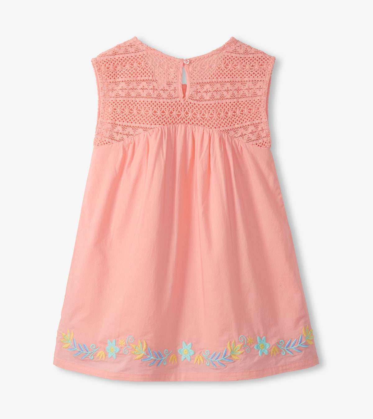 Apricot blush girls dress with crochet bodice and pastel floral embroidery along the hem