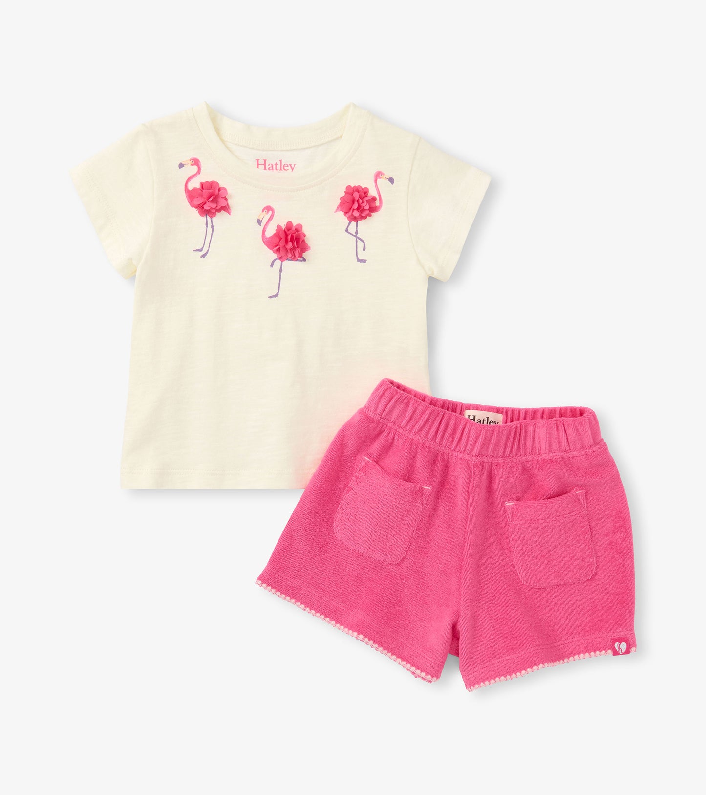 Cream short-sleeve T-shirt with pink flamingo print and bright pink shorts with pockets, front view