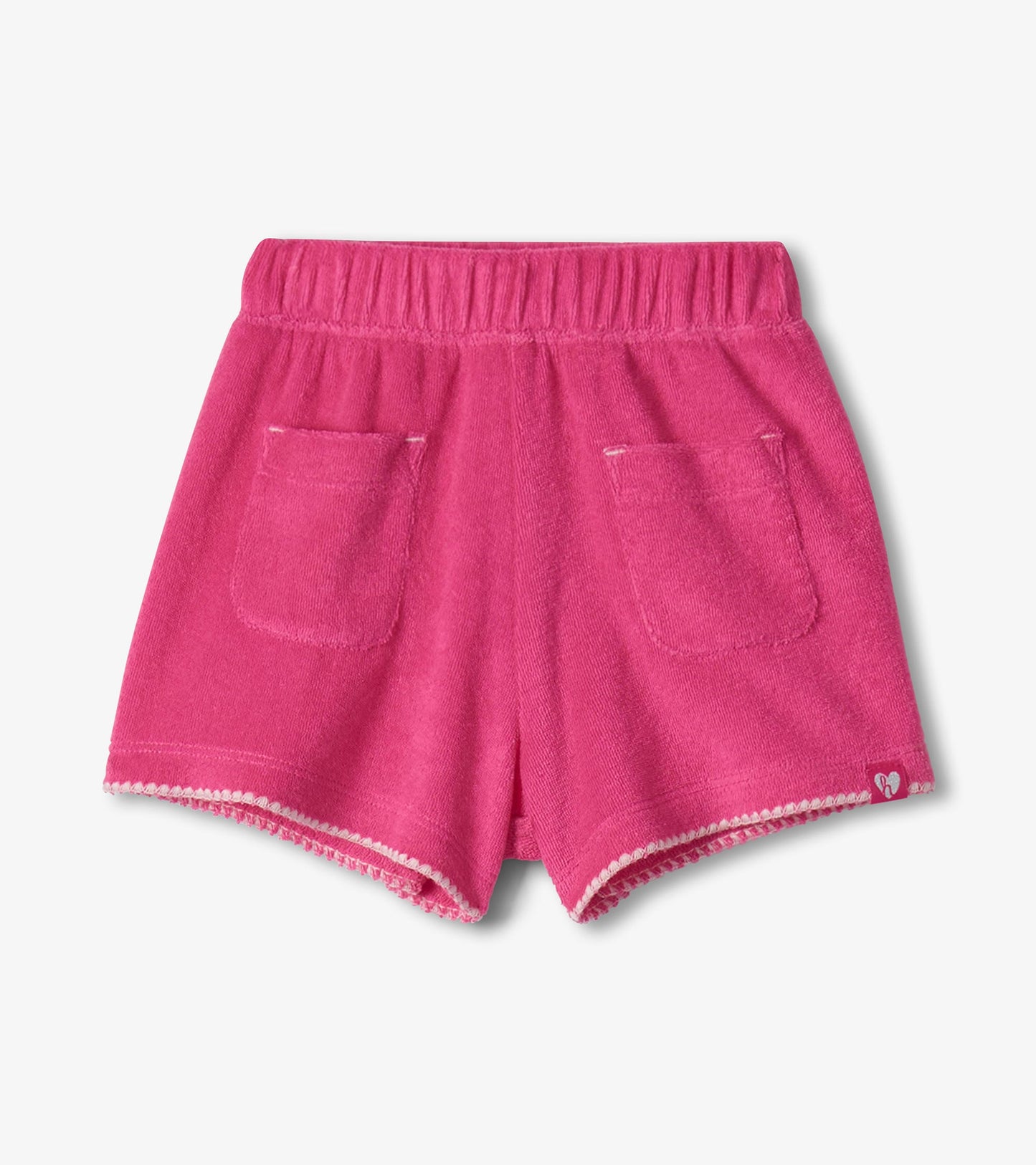 Pink toddler shorts with elastic waistband, front pockets, and scalloped hem, front view