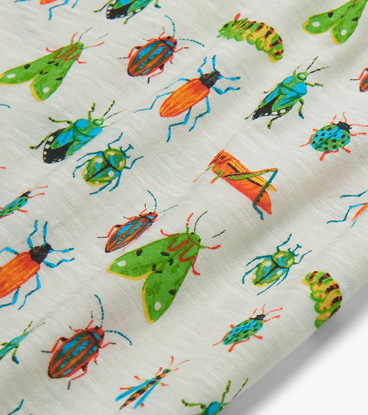 White T-shirt fabric with colorful insect print, shown in close-up