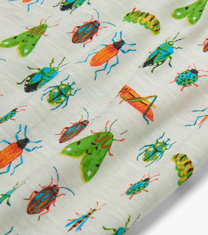 White T-shirt fabric with colorful insect print, shown in close-up
