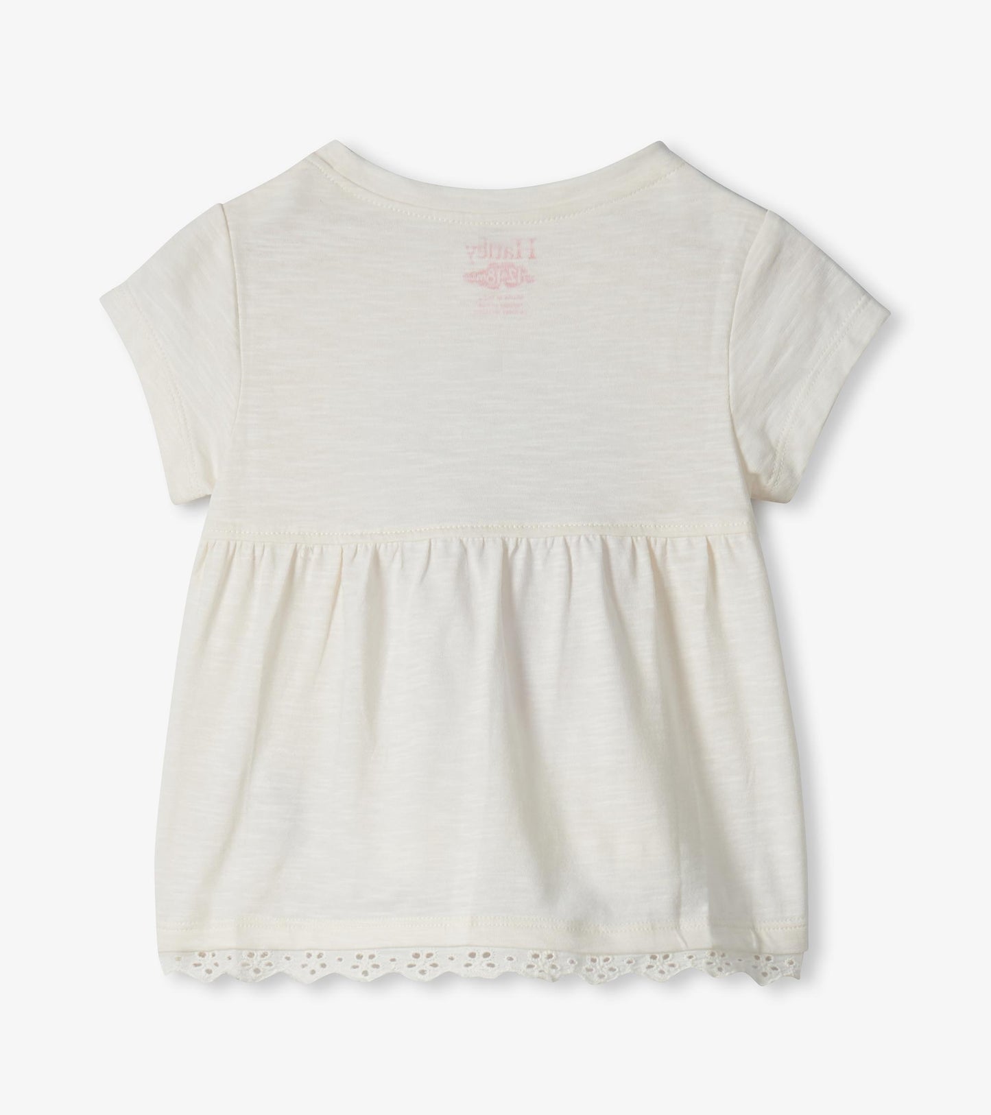 Cream short-sleeve toddler dress with gathered waist and lace hem, back view