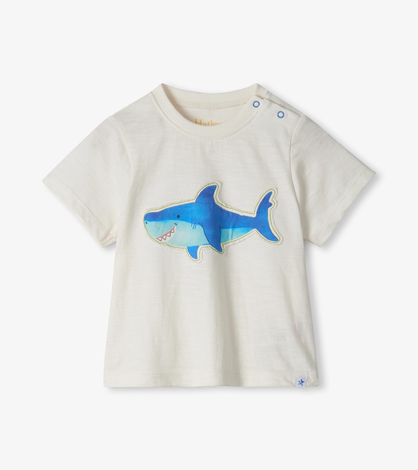 Cream short-sleeve toddler T-shirt with blue shark graphic and shoulder snaps, front view