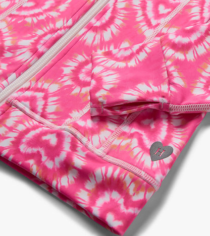 Pink and white tie-dye girls active jacket with zipper, pocket, and heart logo detail, close-up view