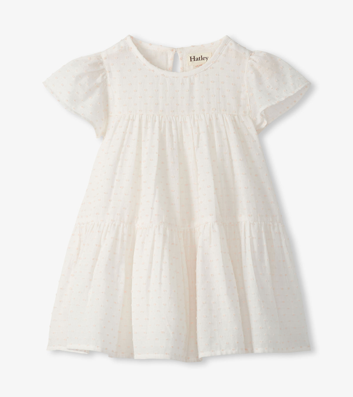 Front view of pearl Swiss dot toddler dress with short puff sleeves, round neck, and tiered skirt