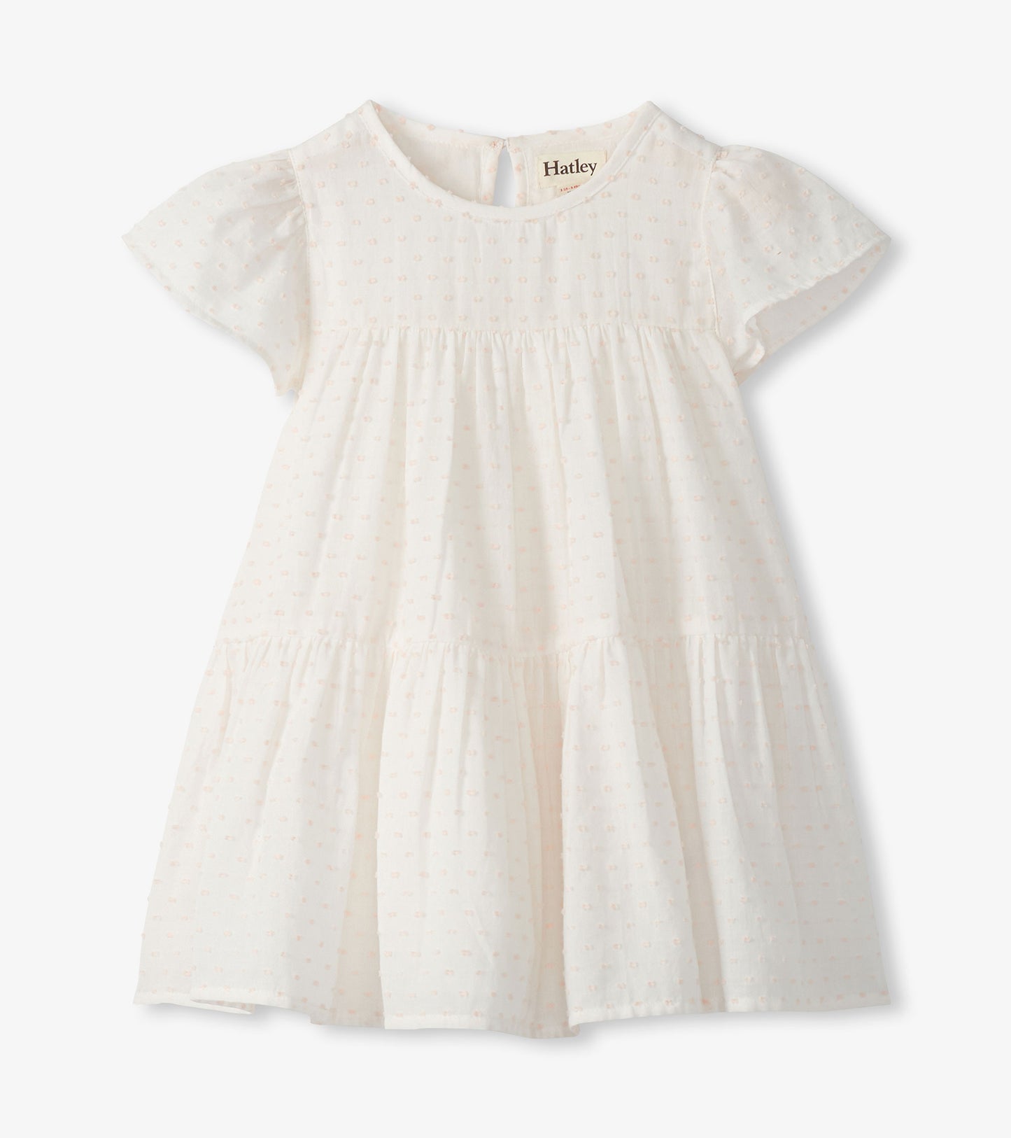 Pearl white Swiss dot toddler dress with puff sleeves, round neck, and tiered skirt on white background