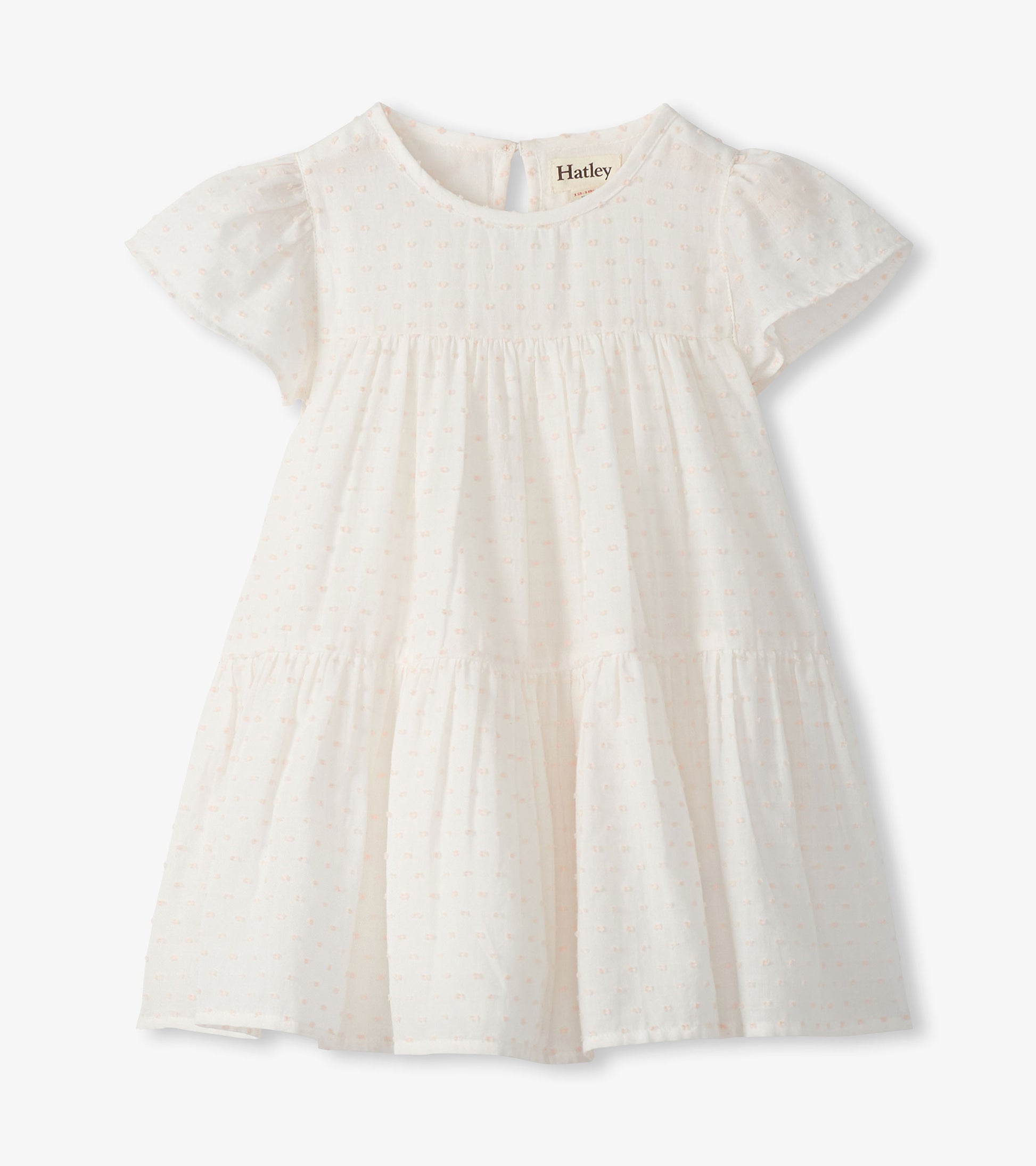 Pearl white Swiss dot toddler dress with puff sleeves, round neck, and tiered skirt on white background