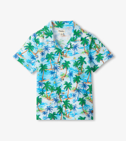 Short-sleeve button-down shirt with light blue tropical palm tree print and collar, front view