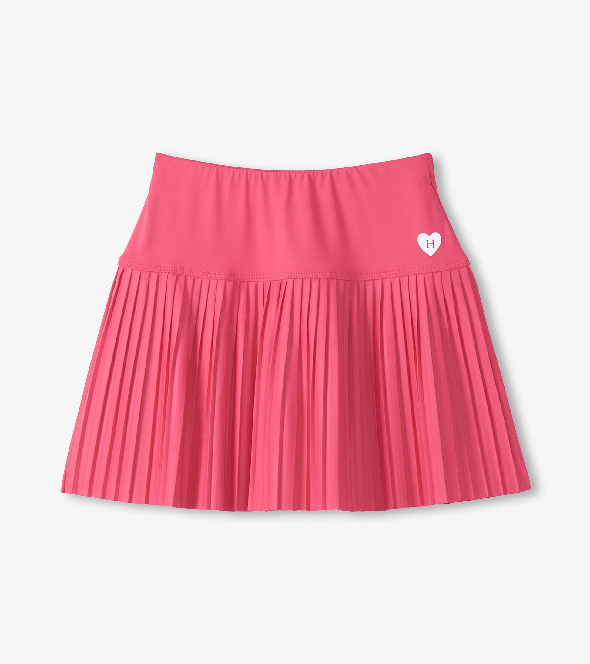 Pink girls sporty skort with pleated skirt and small heart logo on the front