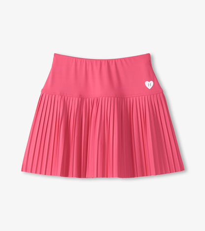 Pink girls sporty skort with pleated skirt and small heart logo on the front