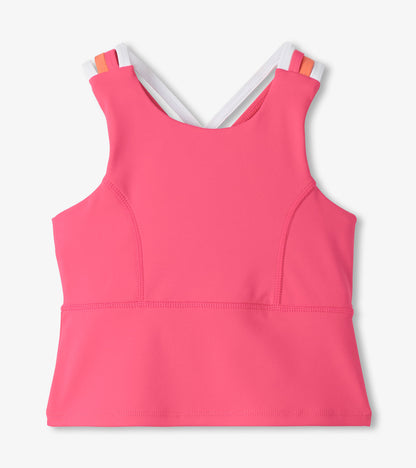 Pink girls active tank top with strappy back and white trim, front view