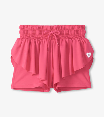 Pink girls running shorts with elastic waistband, drawstring, and layered ruffle front detail