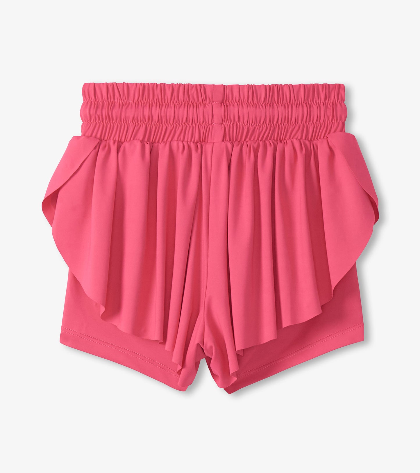 Pink girls running shorts with a smocked waistband and layered ruffle front, front view