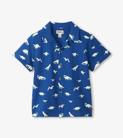 Blue short-sleeve button-down shirt with white dinosaur print, front view