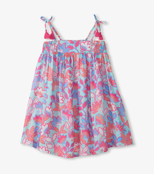 Girls floral print smocked sundress with spaghetti straps and tassel ties, in blue, pink, and coral