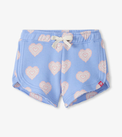 Blue girls pull-on shorts with pink heart print and white drawstring, front view