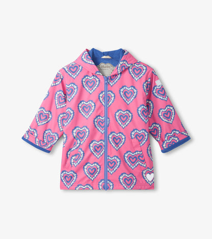 Pink hooded zip-up raincoat with blue heart burst print and blue trim, front view