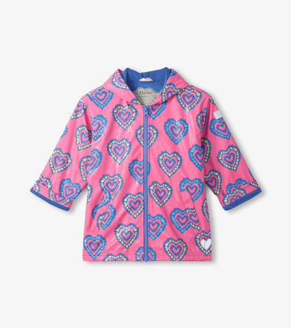 Pink hooded zip-up raincoat with blue trim and multicolor heart pattern, front view