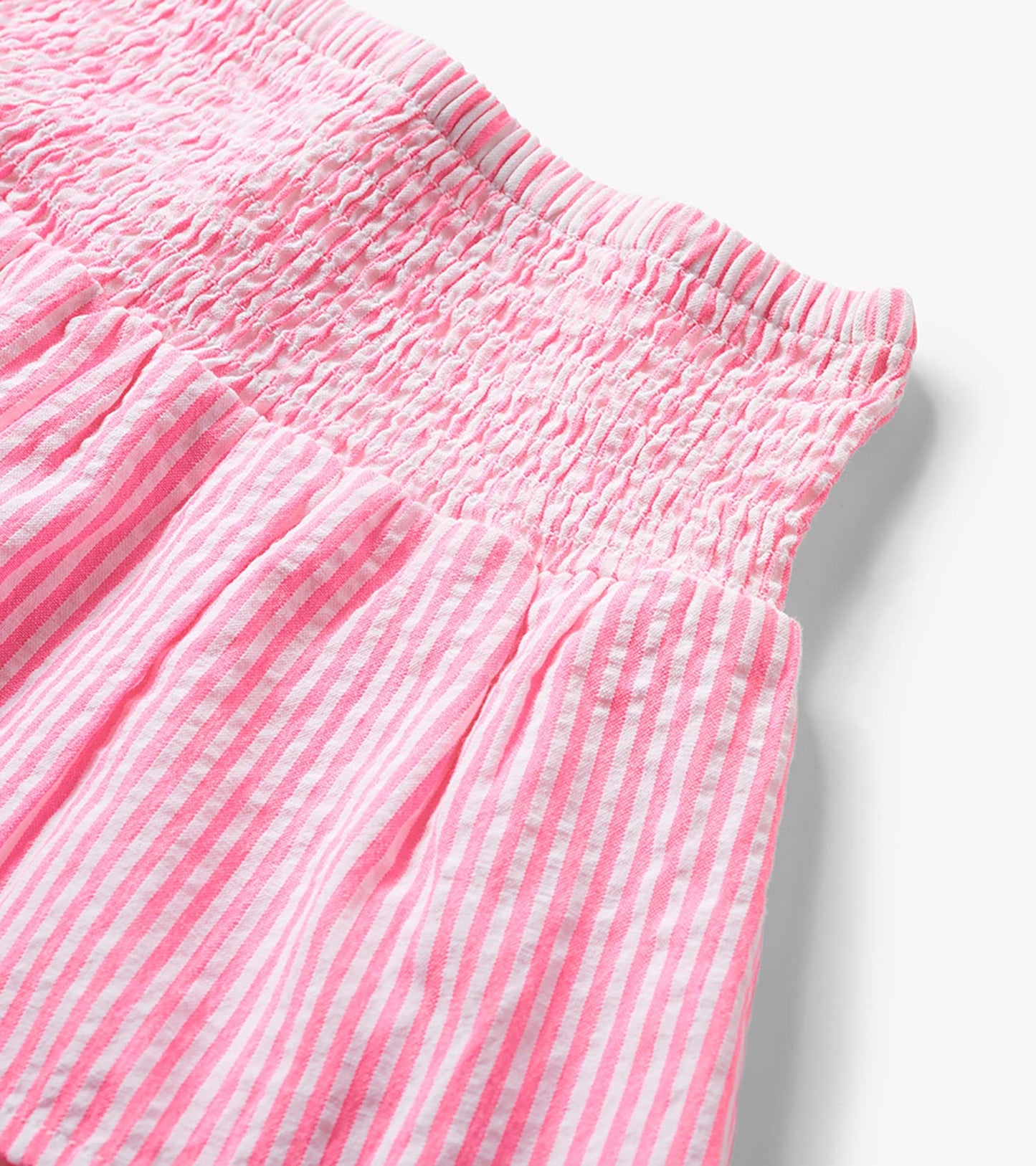 Neon pink and white striped seersucker skirt with smocked waistband