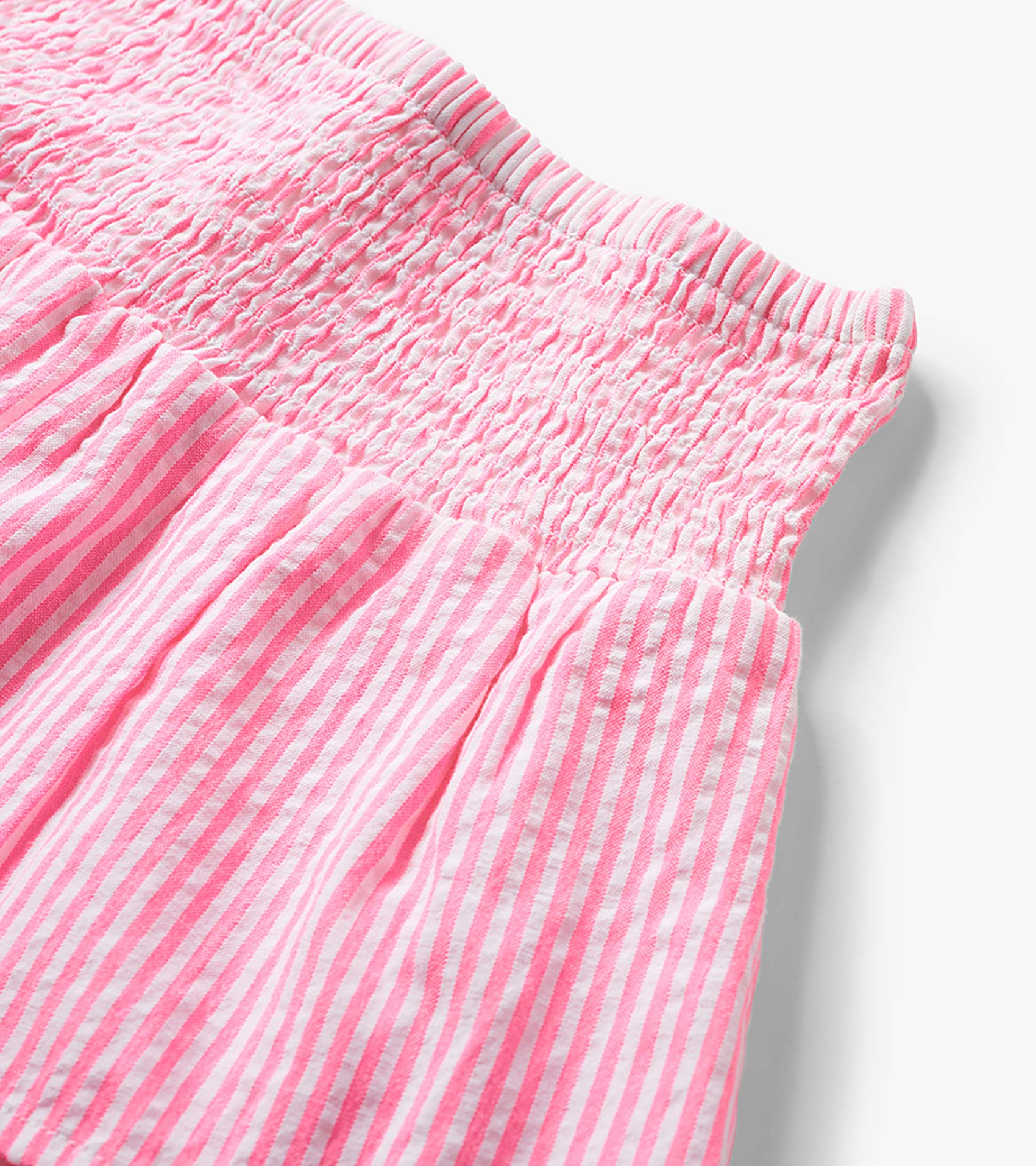 Neon pink and white striped seersucker skirt with smocked waistband