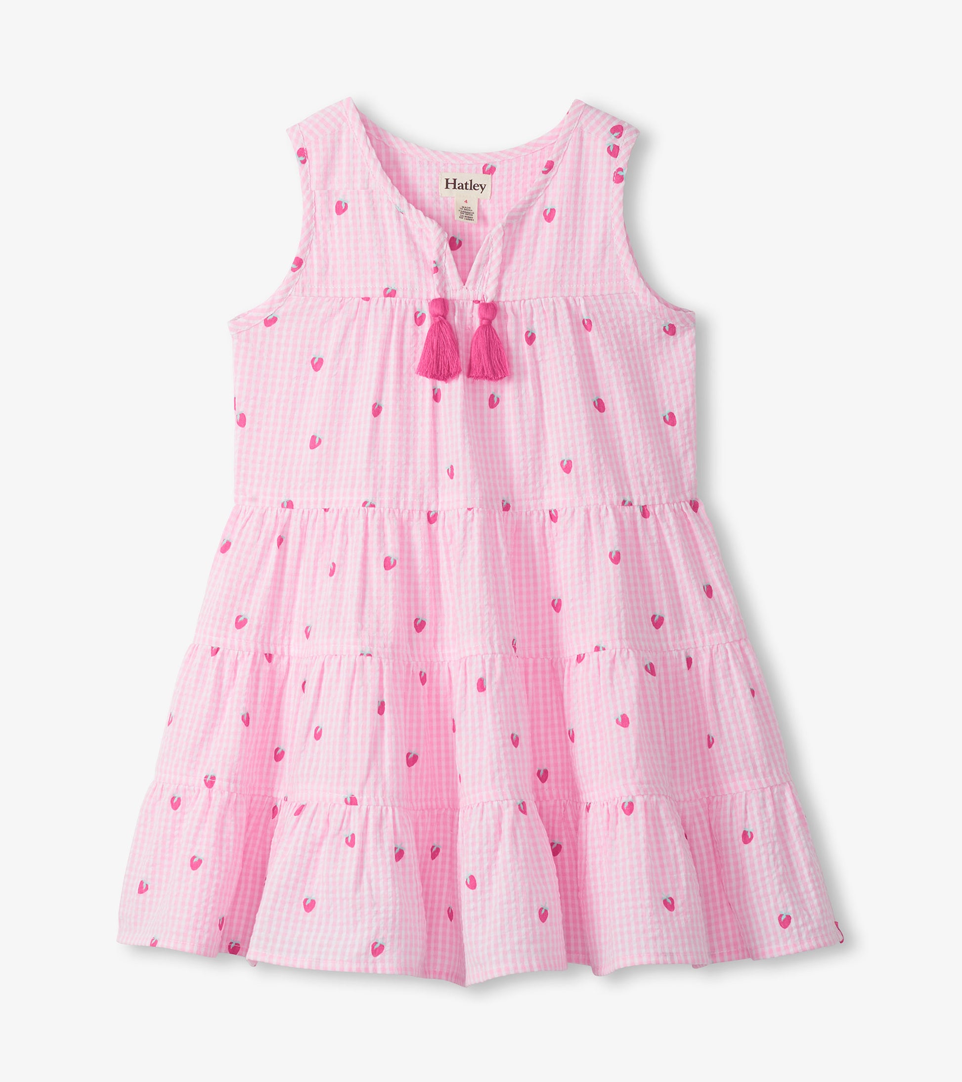 Pink gingham sleeveless tiered dress with small berry print, split neckline, and pink tassel ties