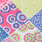 View Girls Mix-Up Patch Work Stretch Bell Bottoms - Patchwork pattern with pink, blue, green, and yellow floral and geometric designs
