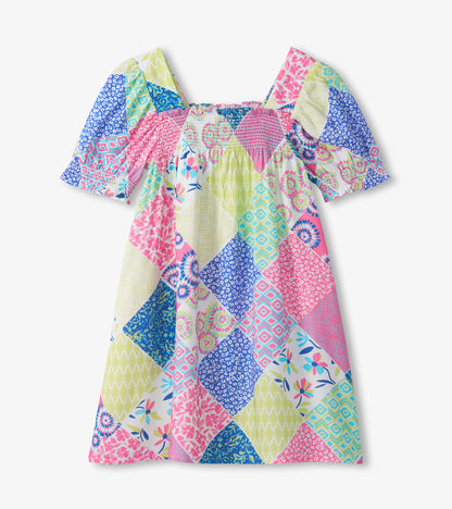 Girls patchwork smocked dress with pink, blue and green print, square neckline and short puff sleeves