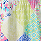 View Girls Mix-Up Patch Work Smocked Dress - Colorful floral and geometric pattern with pink, yellow, blue, and green designs