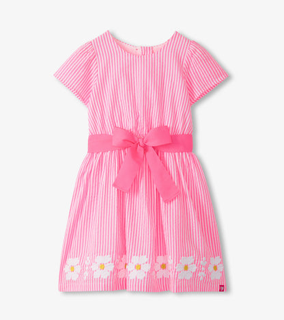 Girls pink and white striped dress with short sleeves, scoop neckline, waist bow, and daisy hem trim