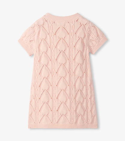 Light pink short-sleeve crochet knit dress with diamond pattern, ribbed neckline and hem, front view