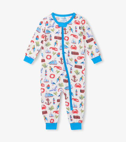 White baby sleeper with blue trim and colorful seascape print, front view, long sleeves and zip closure