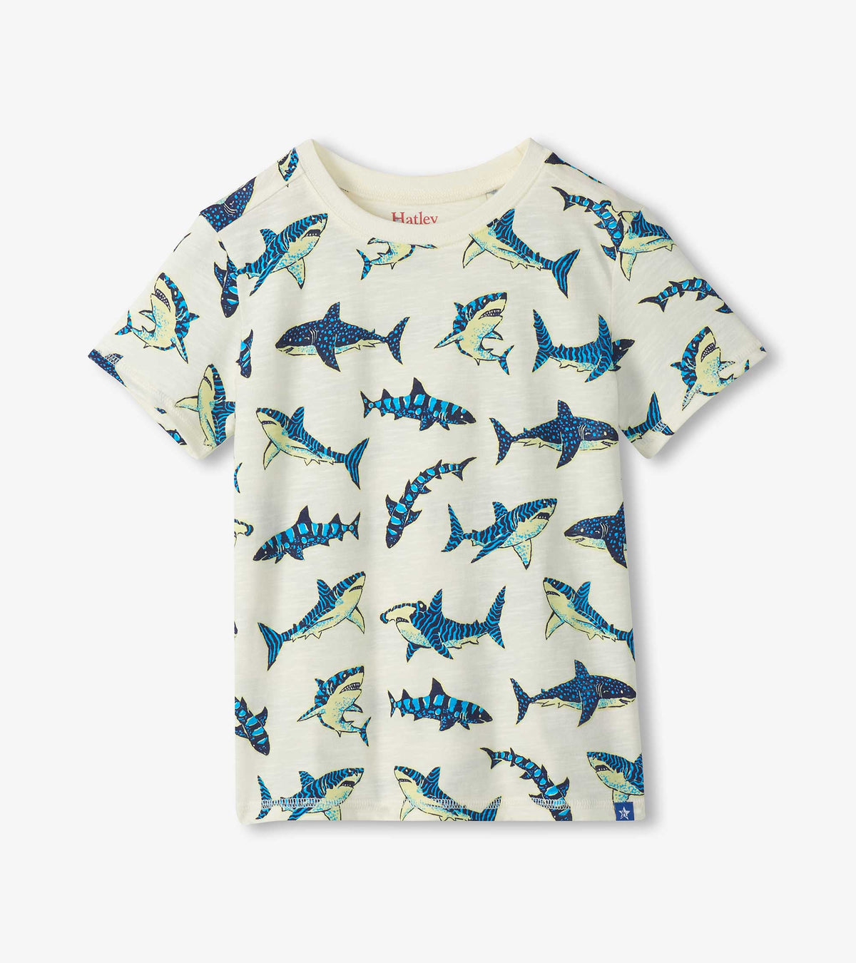 Front view of boys cream crew neck tee with allover blue shark print