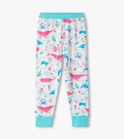 Girls white bamboo pajama pants with colorful sea life print and turquoise cuffs