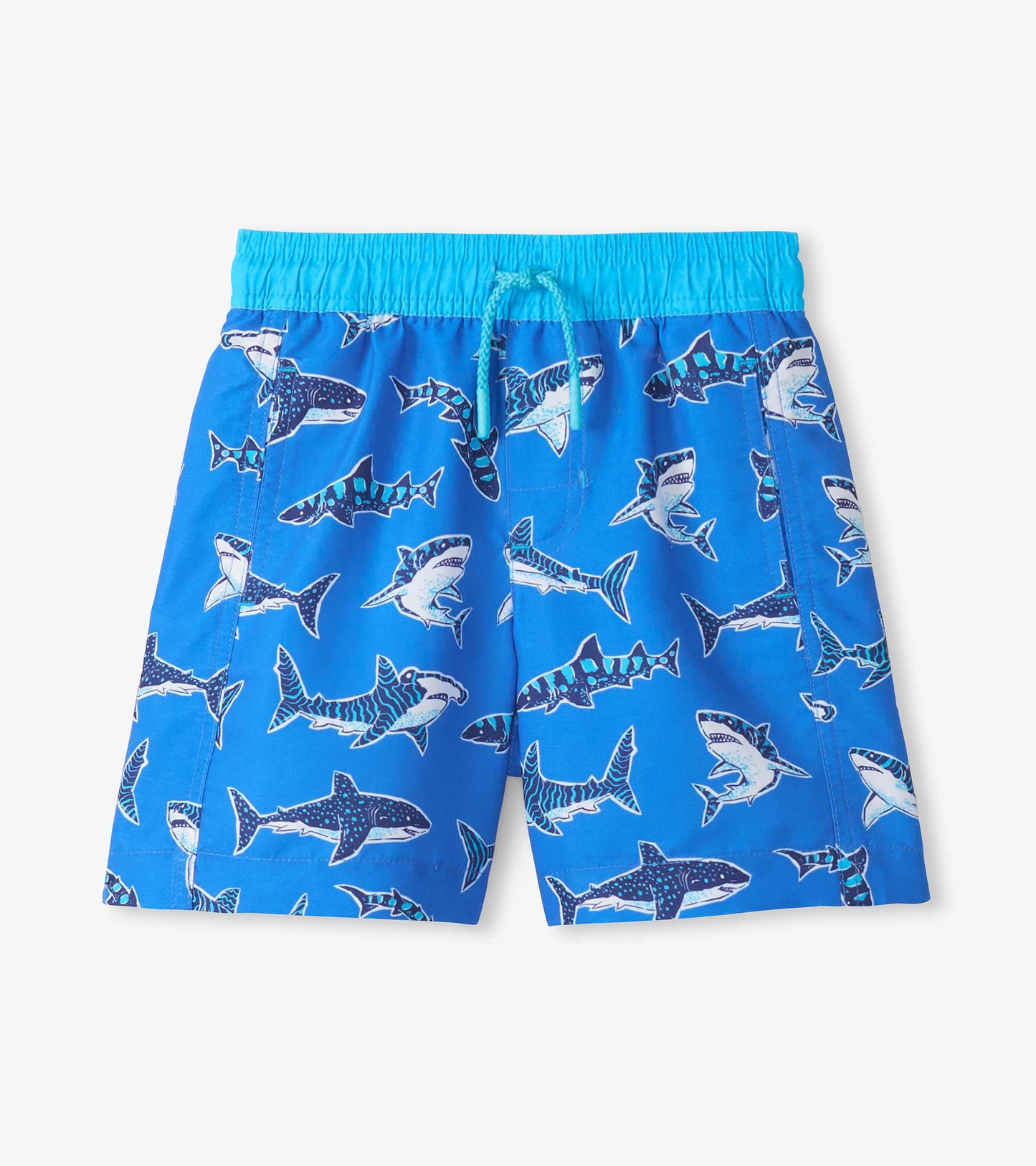 Blue boys swim trunks with shark print, elastic waistband, and drawstring, front view