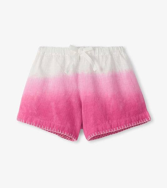 Girls woven shorts with white-to-pink dip dye, elastic waist, and stitched hem detail, front view