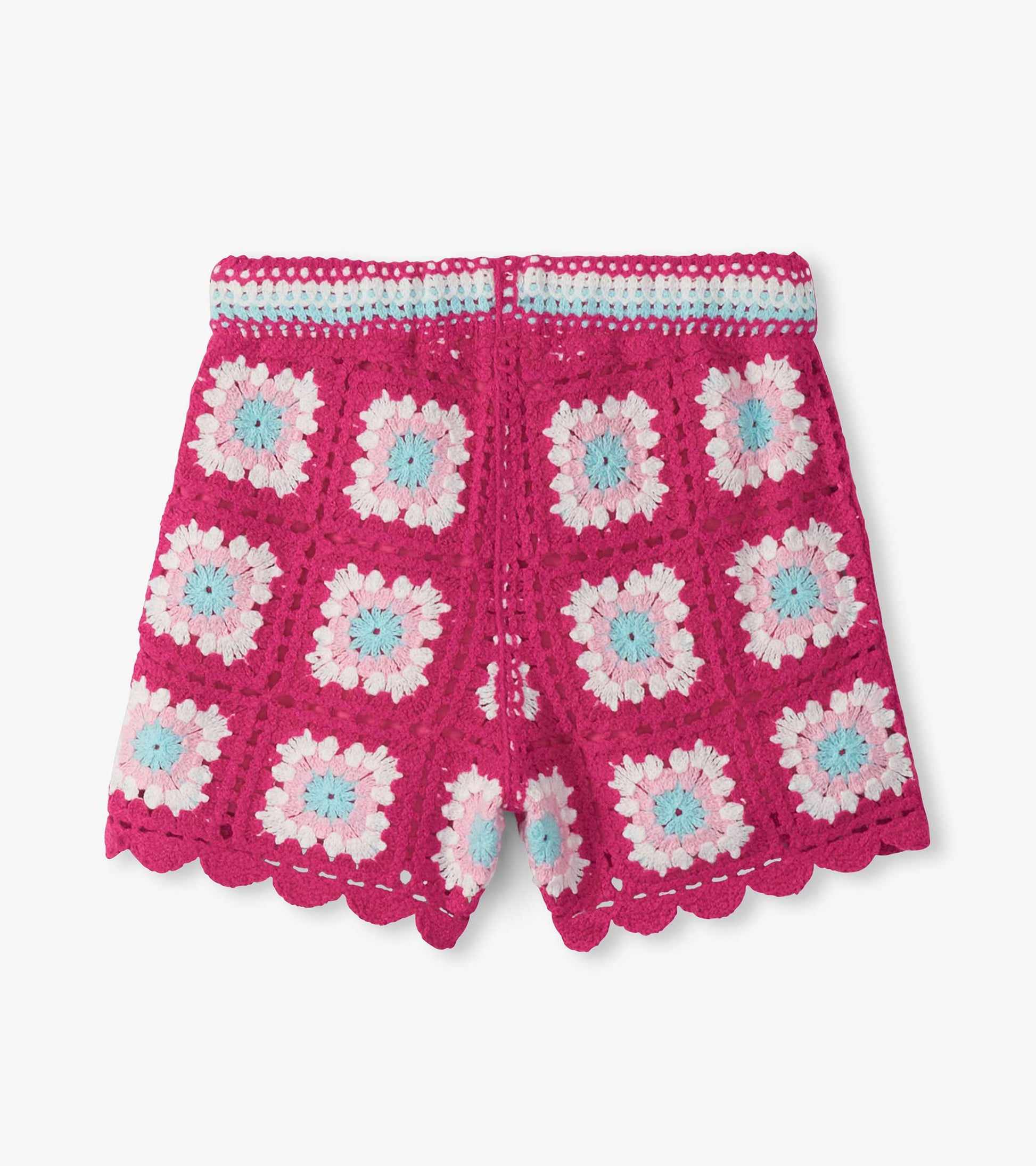 Pink crochet shorts with white, light blue, and pale pink floral pattern and scalloped hem, front view