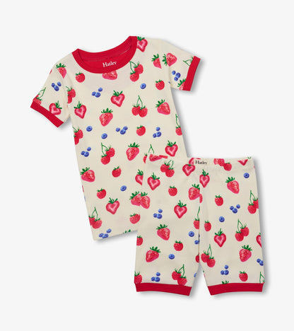 Girls cream cotton short pyjama set with red trim and allover strawberry, raspberry, and blueberry print